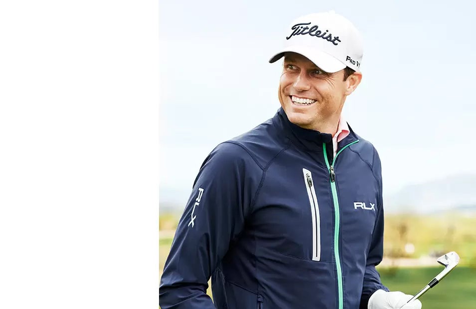 Nick Watney in navy RLX windbreaker with chest vertical zip pocket