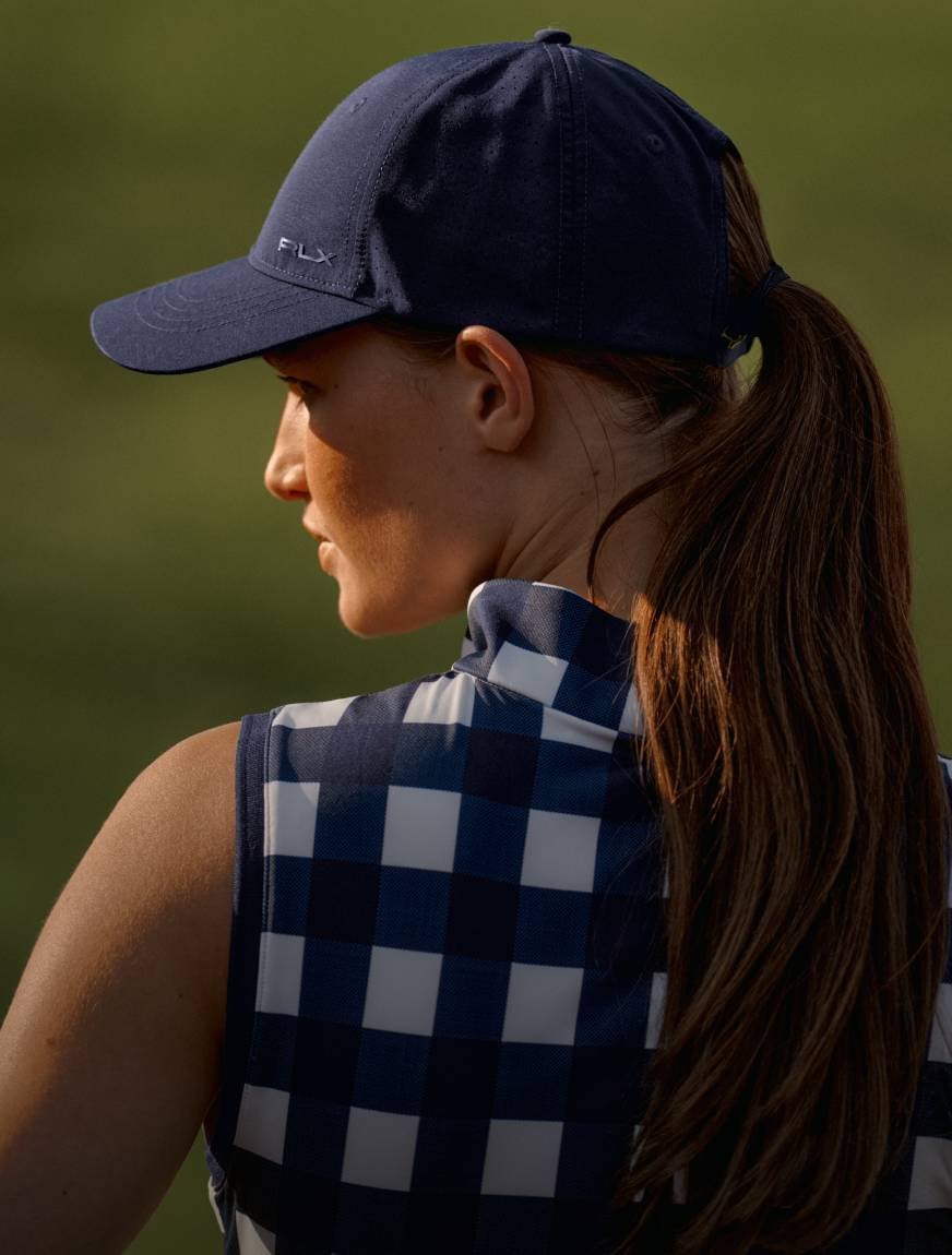Back shot of model wearing golf apparel