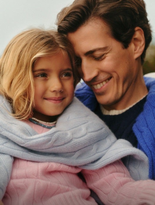 Photograph of dad and daughter in Polo attire.