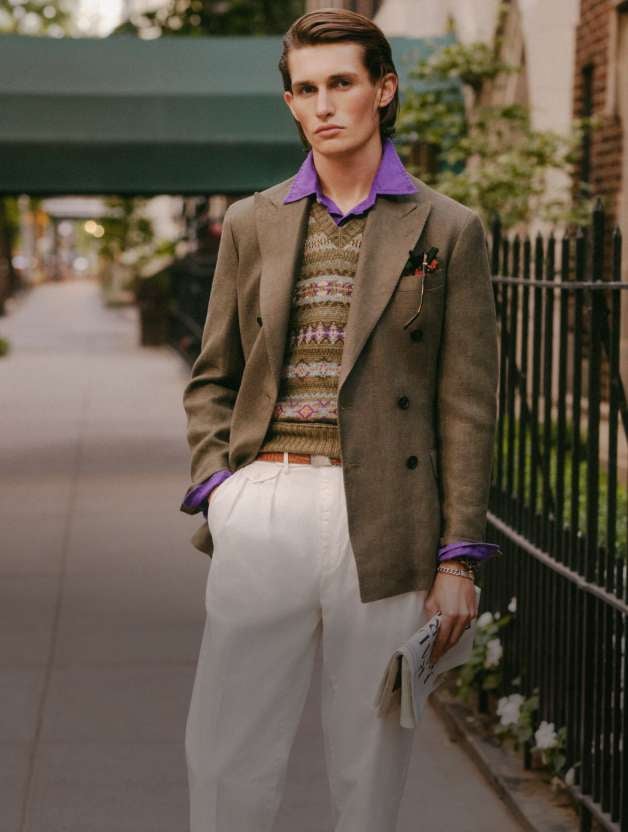 Man wears a brown sport coat over a Fair Isle sweater.