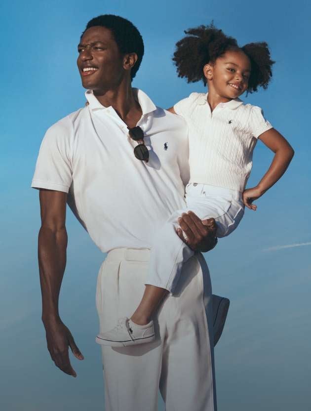 Photograph of dad and daughter in Polo attire.