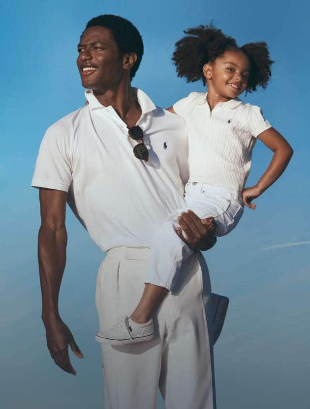 Photograph of dad and daughter in Polo attire.