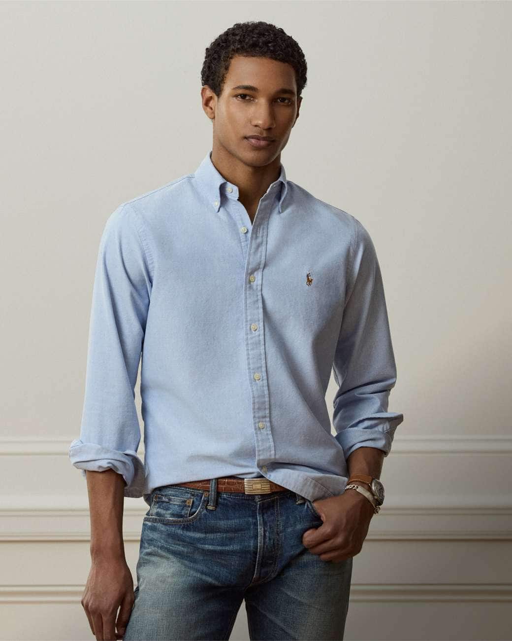 Man wears Classic Fit blue button-down shirt.